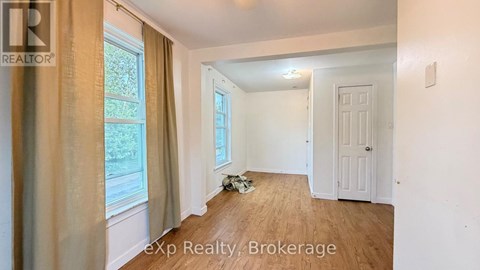 A room with a window and a door is shown in the image.