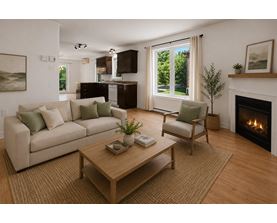A living room with a fireplace and a couch.