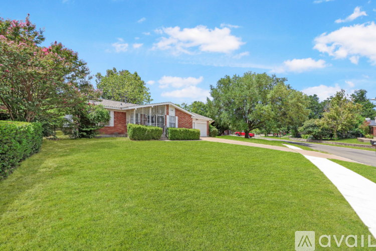 A house with a lawn in front of it.