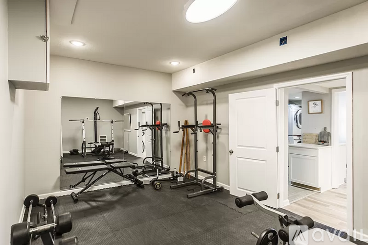 A well-equipped home gym with a variety of exercise equipment.