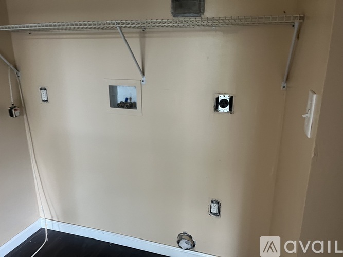 A wall with three cameras installed at different heights and angles.
