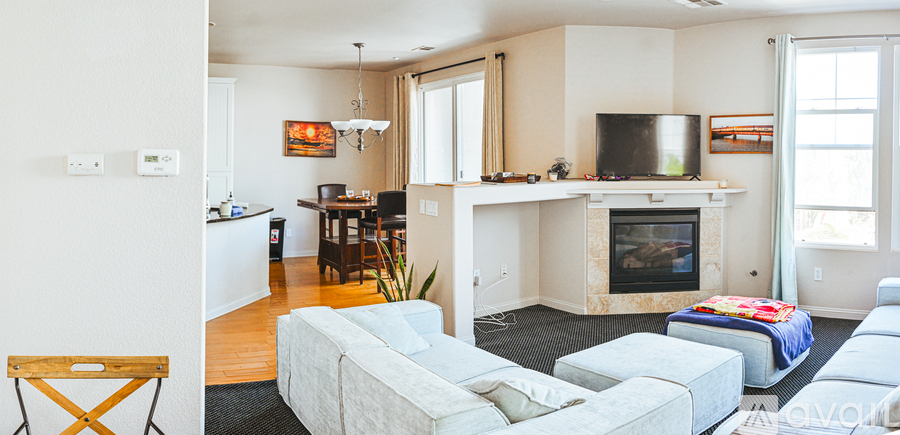 A living room with a fireplace and a couch.