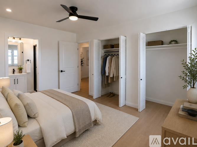 A bedroom with a large bed and a wardrobe.