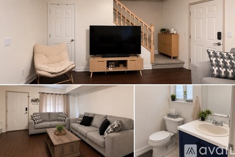 A living room with a grey couch and a wooden coffee table.