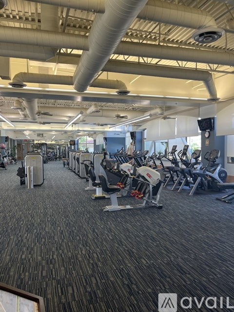 A gym with a variety of exercise equipment.