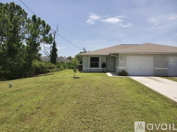 A house with a lawn in front of it is for sale.