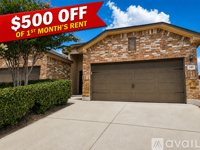 A house with a sign offering $500 off the first month's rent.