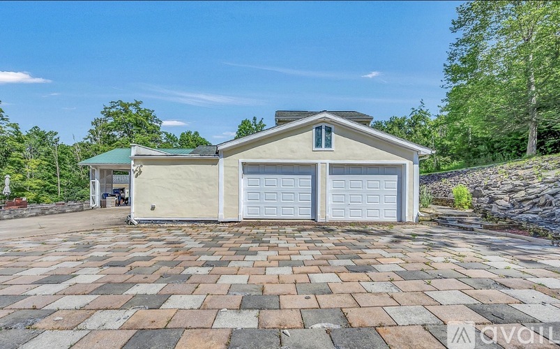 A house with a garage is for sale.