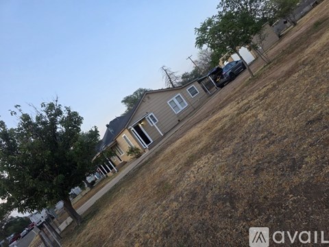 A house with a car parked in front.
