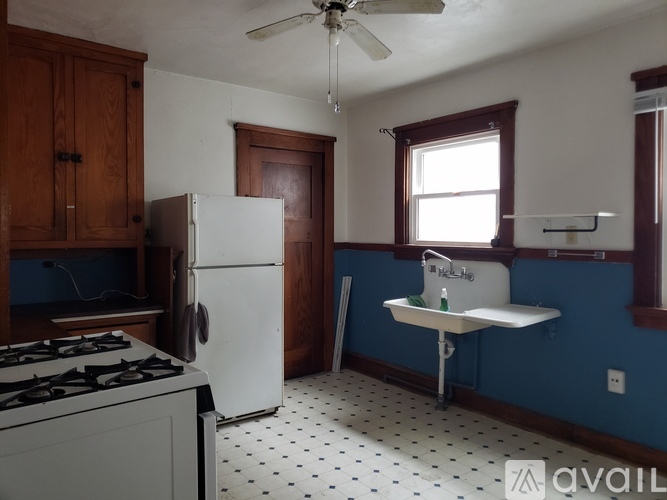 A kitchen with a white fridge and a white stove.