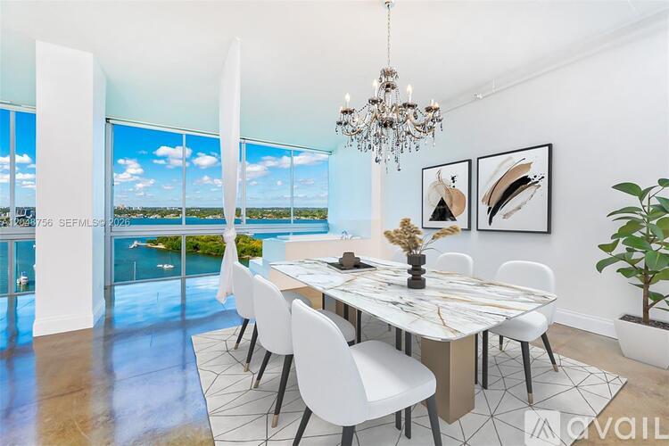 A dining room with a view of the sea.