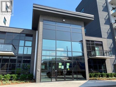 The front of a building with the number 102 on it.