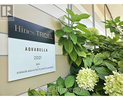 A sign for Hines Tribec Aquabella 2021 is displayed on a wall.