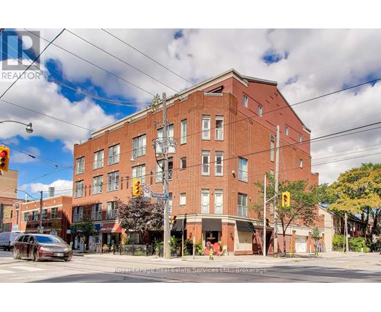 A large red brick building with a sign that says "REALTOR" on it.