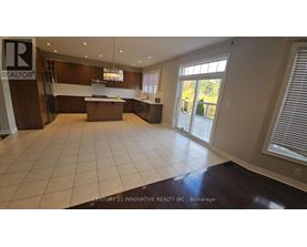 A spacious kitchen with a large island in the middle.