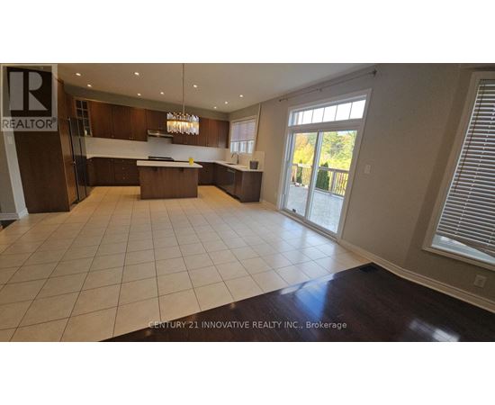 A spacious kitchen with a large island in the middle.