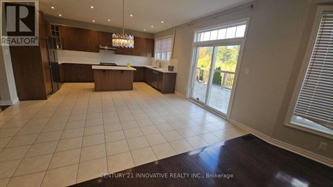A spacious kitchen with a large island in the middle.