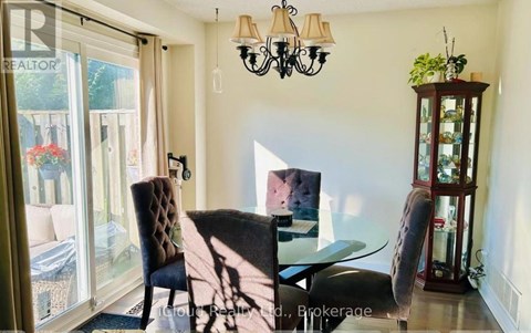 A dining room with a glass table and chairs.