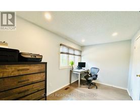 A room with a desk and a chair.