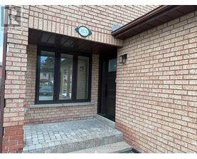 A brick building with a window and a door.