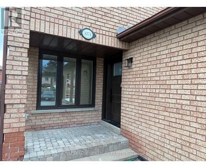 A brick building with a window and a door.
