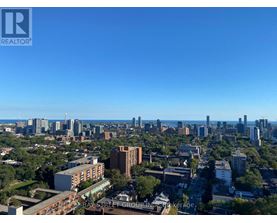 A cityscape with a clear blue sky above it.
