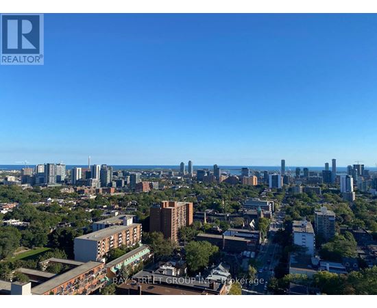 A cityscape with a clear blue sky above it.