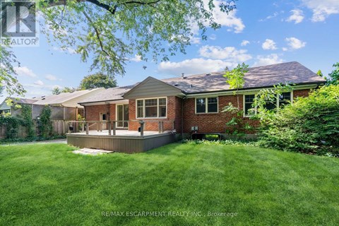A house with a lawn in front of it.