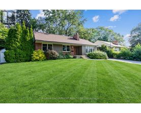 A house with a lawn in front of it.