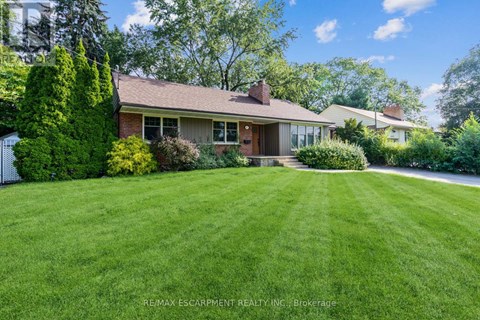 A house with a lawn in front of it.