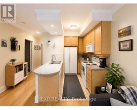 A kitchen with wooden cabinets and a white countertop.