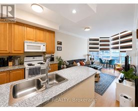A kitchen with a sink and a microwave.
