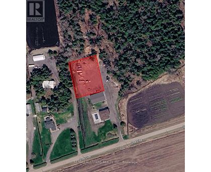 A satellite image shows a red area in the middle of a green field.