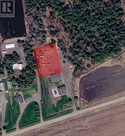 A satellite image shows a red area in the middle of a green field.