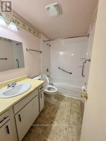 A bathroom with a sink, toilet, and shower.