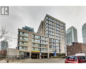 A large building with a Royal LePage Signature Realty Brokerage sign in front.