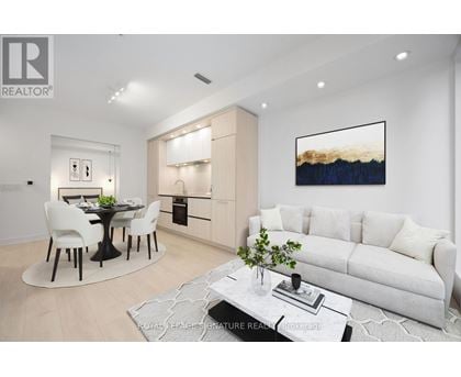 A modern living room with a dining table and chairs.
