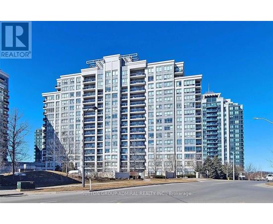 A tall residential building with many windows is shown.