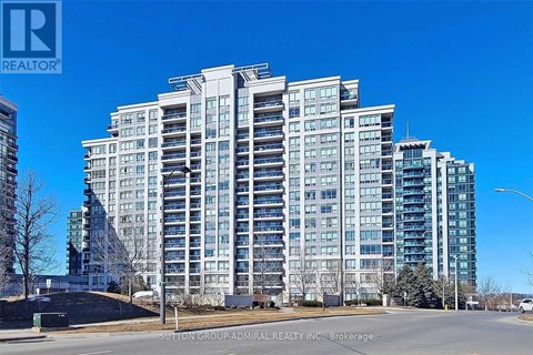 A tall residential building with many windows is shown.