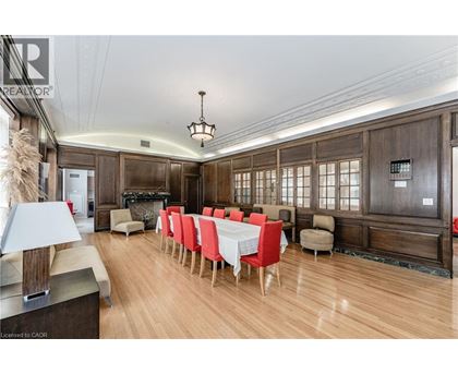 A dining room with a long table set for a meal.