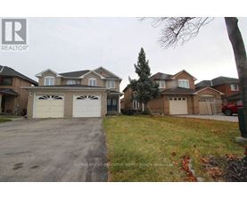 A house with a driveway in front of it.
