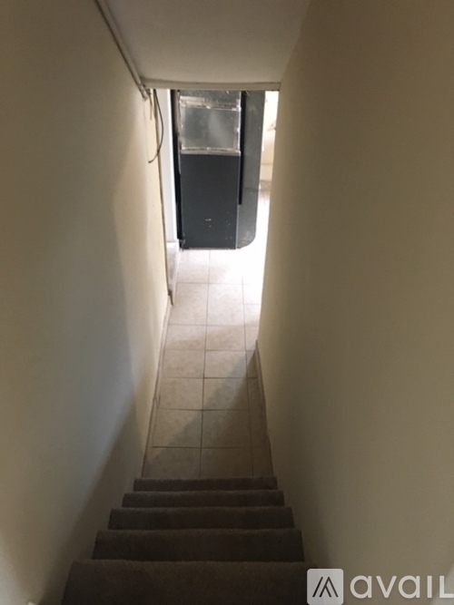 A stairway leading to a door in a building.