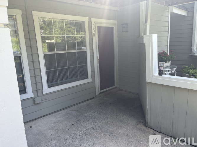 A small porch area with a door and a window.