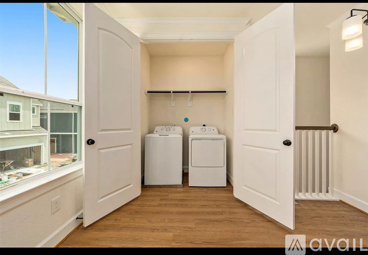 A laundry room with a washer and dryer in it.