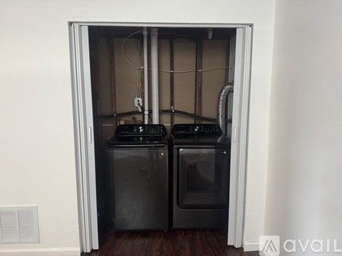 A small kitchen with a refrigerator and oven.
