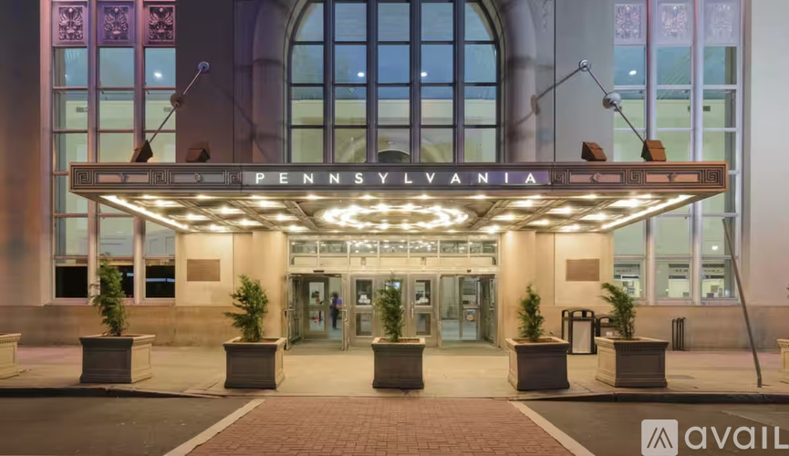 The Pennsylvania building is lit up at night.