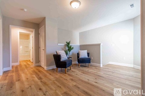 A living room with a couch and a chair.