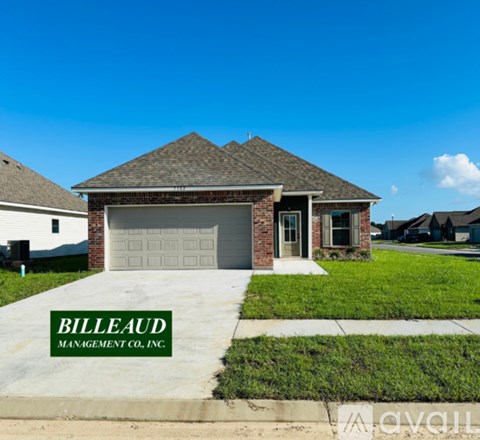 A house with a driveway in front that says Billeaud Management Co. Inc.