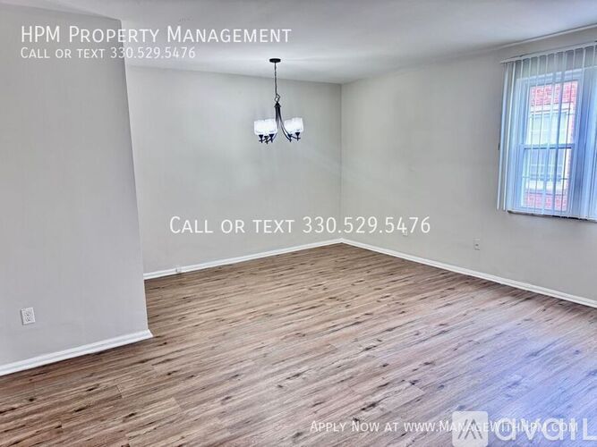 A room with HPM Property Management written on the wall.