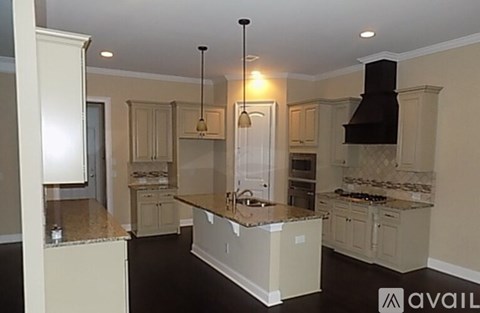 A kitchen with a large island in the middle.
